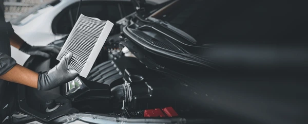 auto-mechanic-holding-old-car-600nw-2374742193